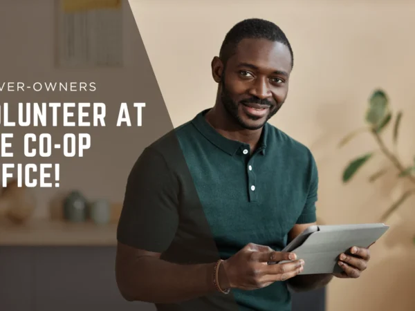 Text asking drivers to volunteer at the office with an image of a black man holding an ipad